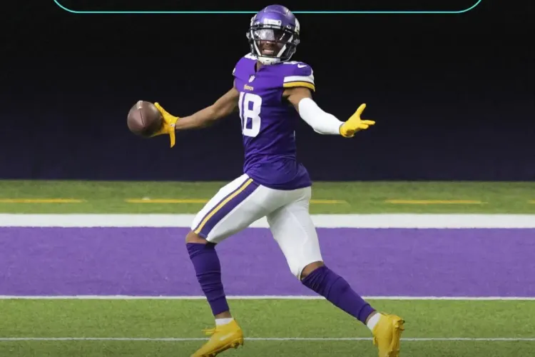 NFL player celebrates touchdown in the end zone wearing a Minnesota Vikings uniform.